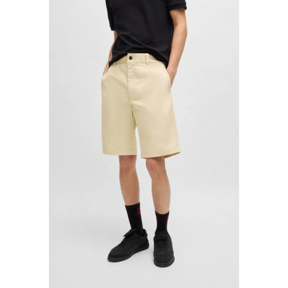 Regular-fit shorts with slim leg and buttoned pockets